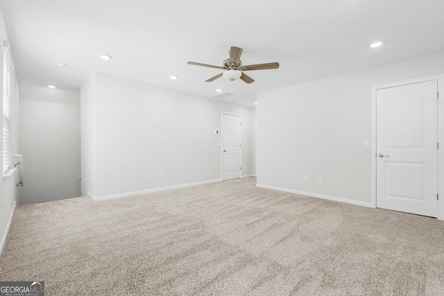 carpeted spare room featuring recessed lighting, baseboards, and ceiling fan