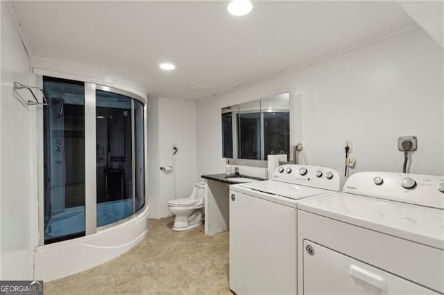 laundry area featuring laundry area, recessed lighting, and washing machine and clothes dryer