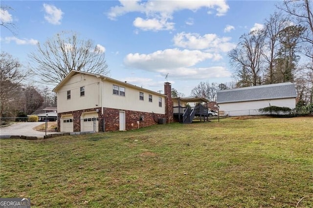 view of property exterior with brick siding, fence, a lawn, a chimney, and an attached garage