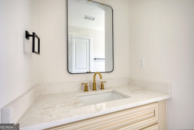 bathroom with visible vents and vanity