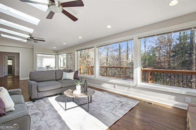 living room with visible vents, baseboards, recessed lighting, wood finished floors, and a ceiling fan