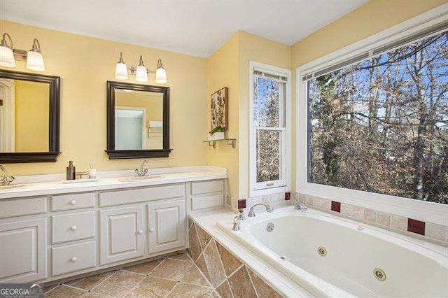 full bathroom with double vanity and a whirlpool tub