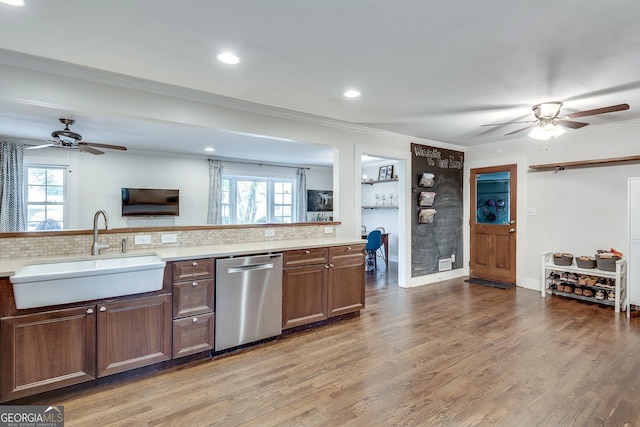 kitchen featuring a healthy amount of sunlight, stainless steel dishwasher, a ceiling fan, and a sink