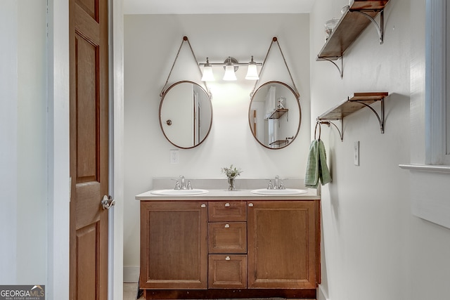 bathroom featuring double vanity and a sink