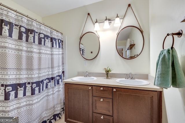 bathroom with double vanity and a sink