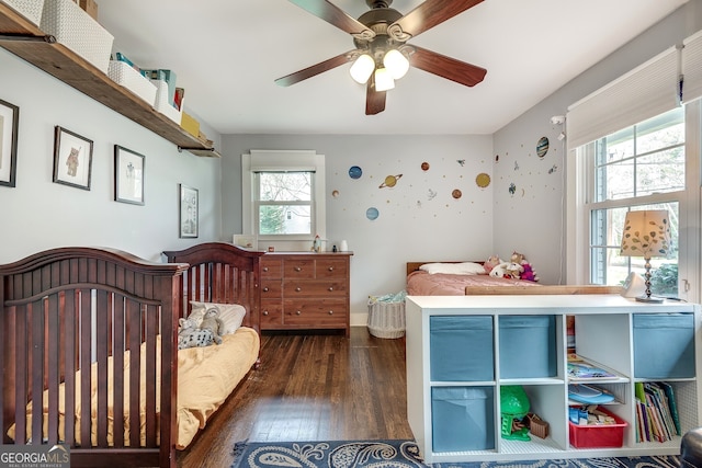 bedroom with dark wood finished floors and a ceiling fan