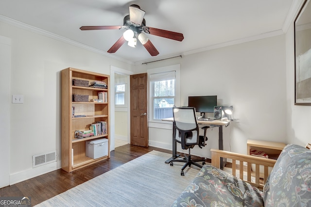 office featuring visible vents, crown molding, a ceiling fan, and wood finished floors