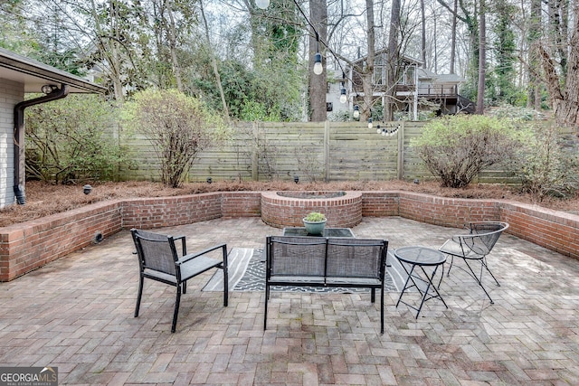 view of patio featuring fence