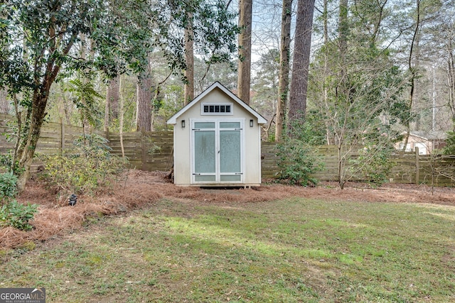 view of shed featuring a fenced backyard