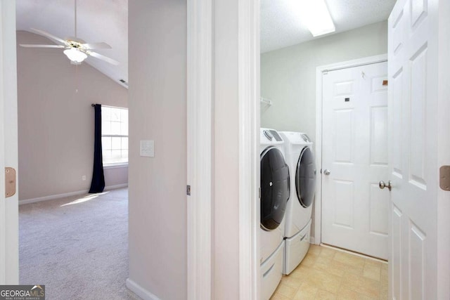 laundry room with baseboards, ceiling fan, light colored carpet, laundry area, and separate washer and dryer