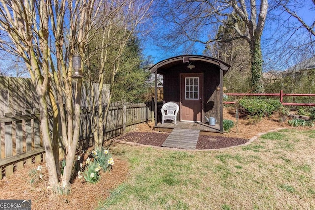 view of shed with a fenced backyard