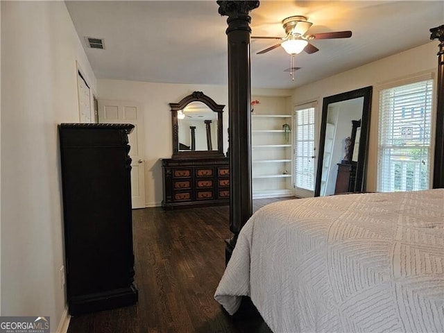 bedroom featuring a ceiling fan, wood finished floors, and visible vents