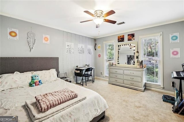 carpeted bedroom featuring visible vents, multiple windows, and crown molding