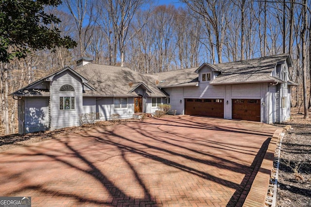 view of front of house with an attached garage and driveway