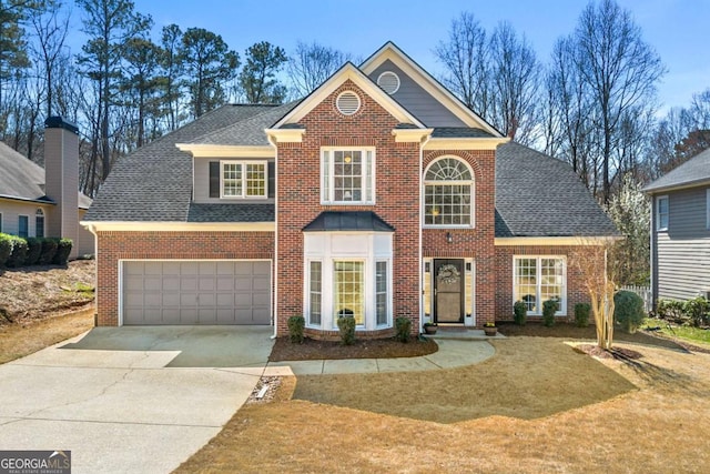 view of front of property featuring brick siding, concrete driveway, and a shingled roof