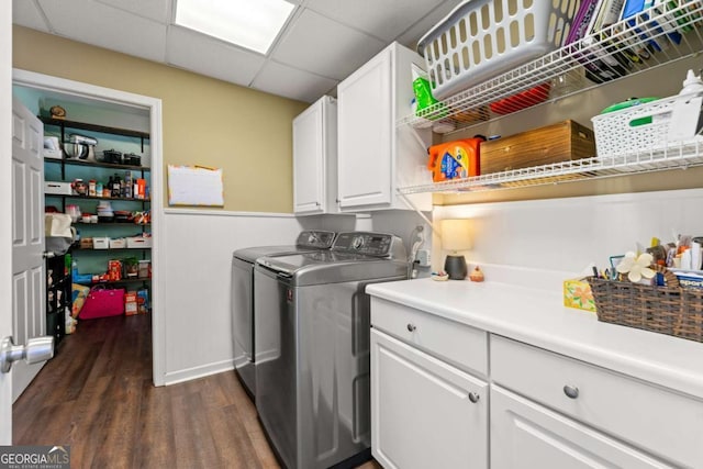 laundry area with washer and clothes dryer, dark wood-style floors, and cabinet space