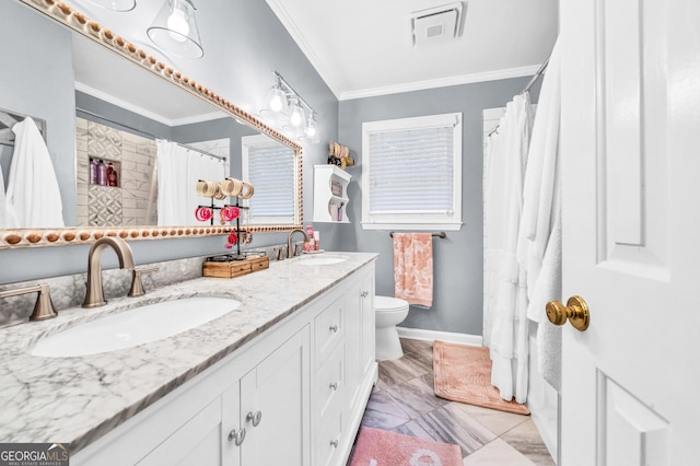 full bathroom featuring a sink, visible vents, toilet, and crown molding