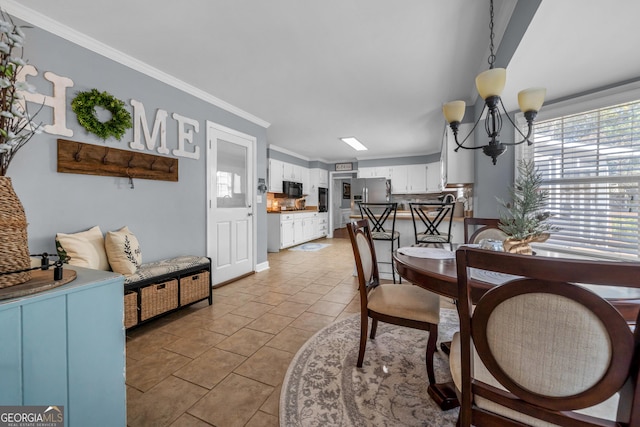 dining space with ornamental molding, light tile patterned floors, and a chandelier