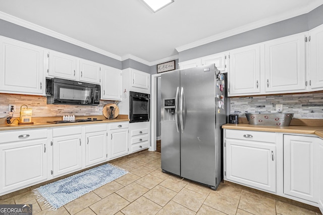 kitchen with decorative backsplash, black appliances, white cabinets, and light countertops