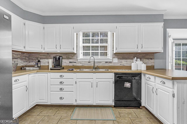 kitchen featuring a sink, dishwasher, a peninsula, and white cabinets