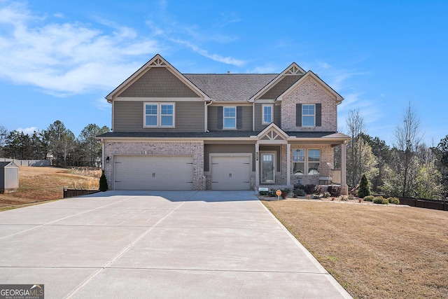 craftsman-style home featuring a front lawn, roof with shingles, concrete driveway, an attached garage, and brick siding