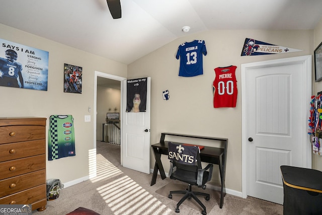 home office with baseboards, carpet, a ceiling fan, and vaulted ceiling