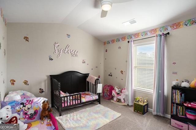 bedroom featuring visible vents, baseboards, lofted ceiling, carpet floors, and a ceiling fan