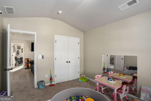 game room with visible vents, carpet floors, baseboards, and vaulted ceiling