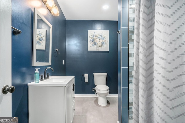 bathroom featuring vanity, curtained shower, toilet, and baseboards