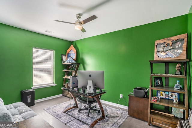 office with visible vents, baseboards, and a ceiling fan