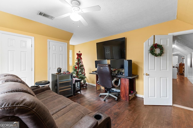 office featuring ceiling fan, visible vents, baseboards, and wood finished floors