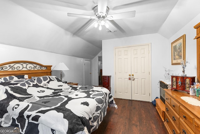 bedroom with visible vents, a ceiling fan, dark wood finished floors, a closet, and lofted ceiling