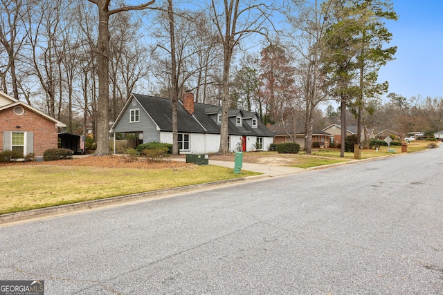 view of road with a residential view and curbs