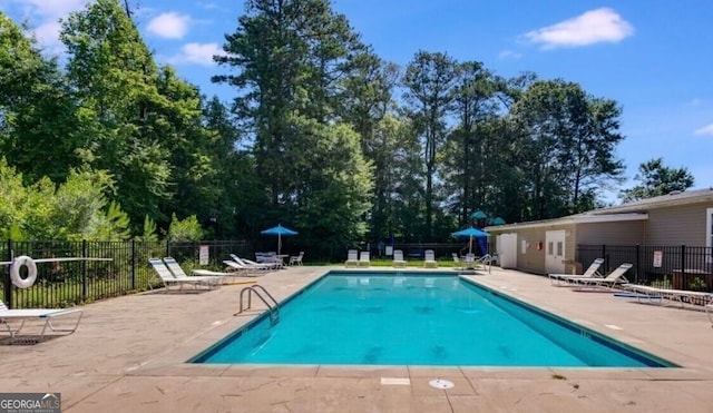 pool featuring a patio and fence