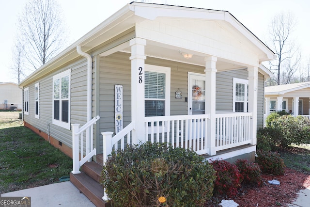 view of front of property with crawl space and covered porch