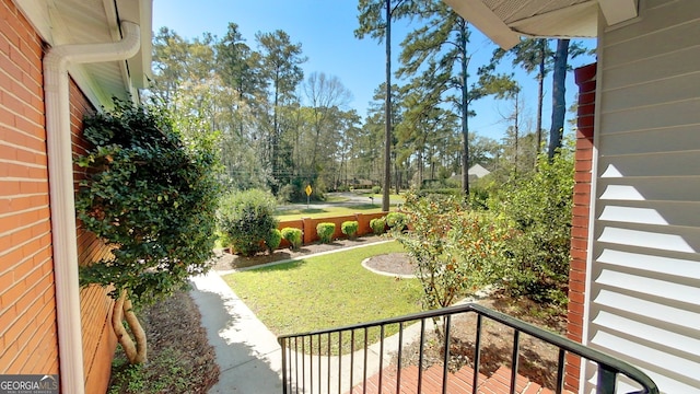 view of yard with a balcony