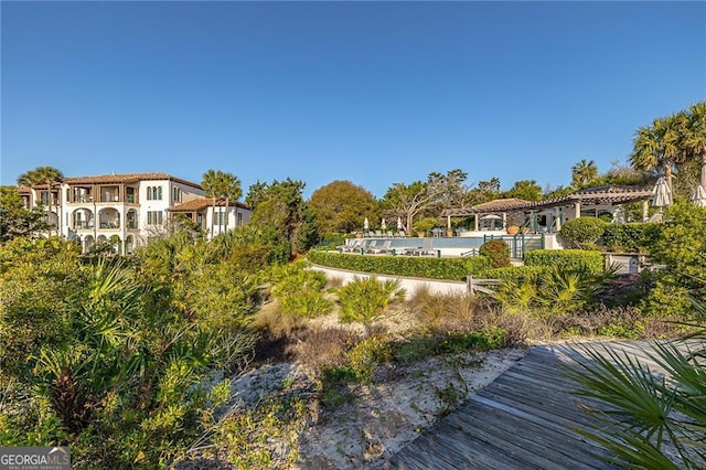 view of home's community with a pergola