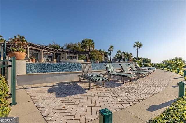 view of pool featuring a patio and a pergola