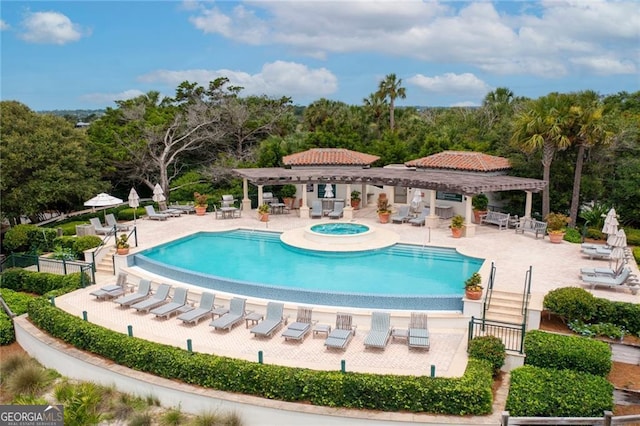 pool featuring a community hot tub, a patio area, and a pergola