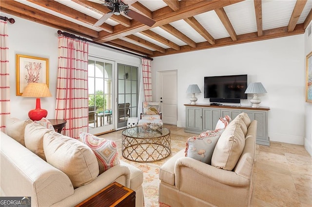 living area featuring beam ceiling, baseboards, and ceiling fan