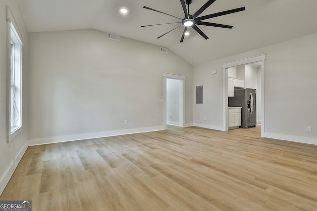 unfurnished living room featuring visible vents, ceiling fan, light wood-style flooring, and lofted ceiling