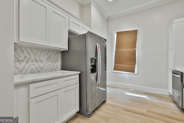 kitchen featuring light wood-type flooring, baseboards, stainless steel refrigerator with ice dispenser, and white cabinetry