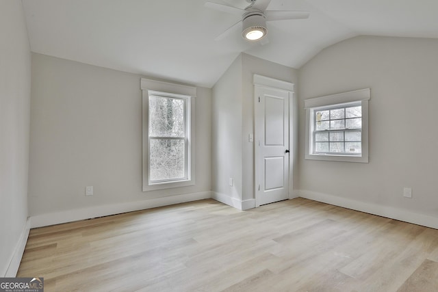 bonus room with plenty of natural light, wood finished floors, a ceiling fan, and vaulted ceiling