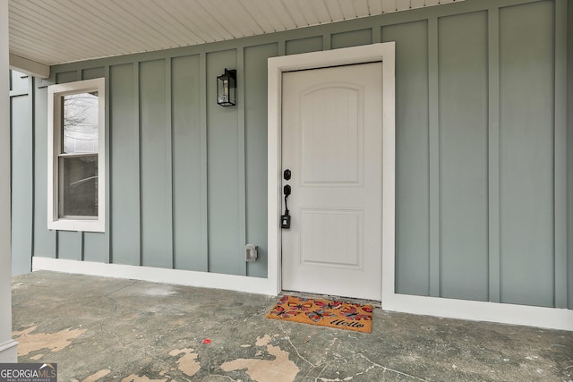 property entrance with board and batten siding