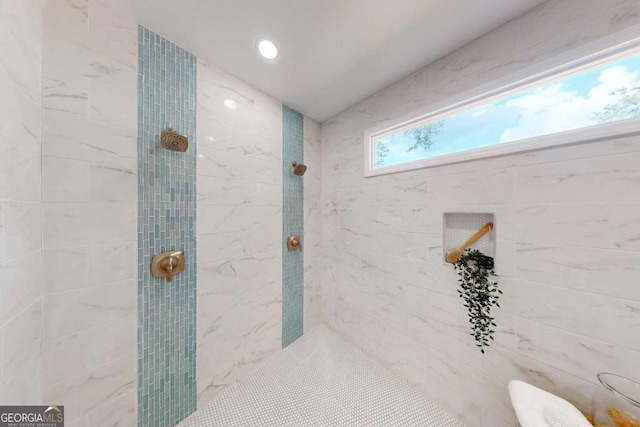 full bath with tiled shower
