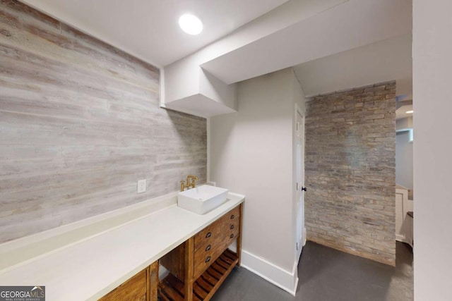 bathroom featuring vanity and baseboards