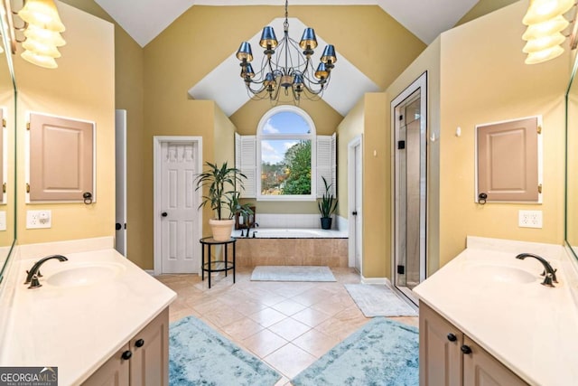 bathroom with tile patterned flooring, lofted ceiling, a notable chandelier, and a sink