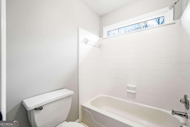 bathroom with toilet and shower / bathtub combination