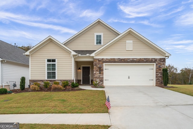 view of front of home with stone siding, an attached garage, concrete driveway, and a front lawn