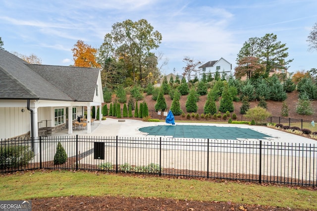 view of swimming pool with a fenced in pool, a patio area, and fence